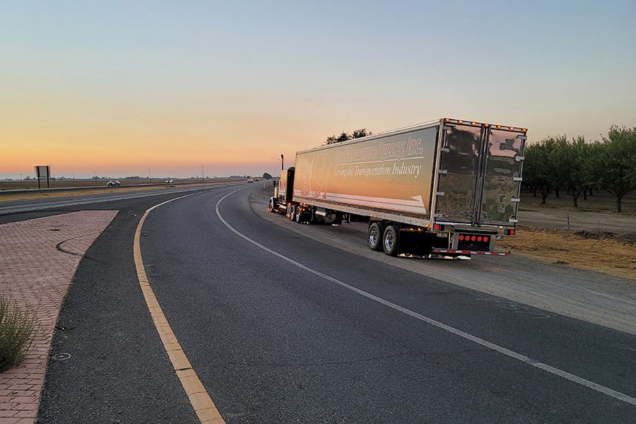 Fleet Insurance - Large Truck Parked on the Side of a Highway Road at Sunset on a Nice Day